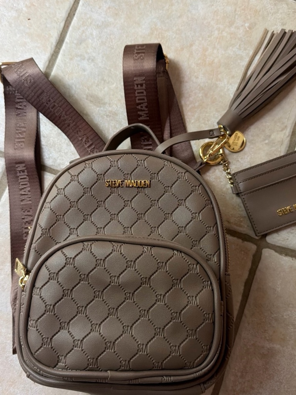 Steve Madden Brown Quilted Mini Backpack with Tassel Charm